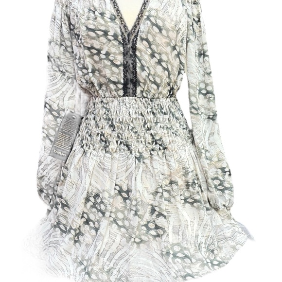 bebe Dresses & Skirts - BEBE Dress with plenty smocking on shoulders , sleeves and yoke of the skirt.